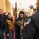 Kevin Seefried, second from left, holds a Confederate battle flag as he and other insurrectionists loyal to President Donald Trump are confronted by U.S. Capitol Police officers outside the Senate Chamber inside the Capitol in Washington, Jan. 6, 2021.